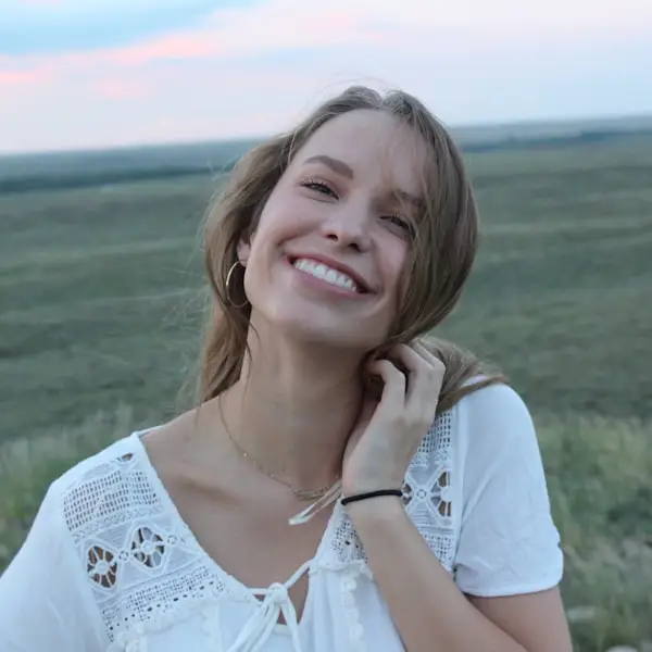 Smiling hotel guest outdoors